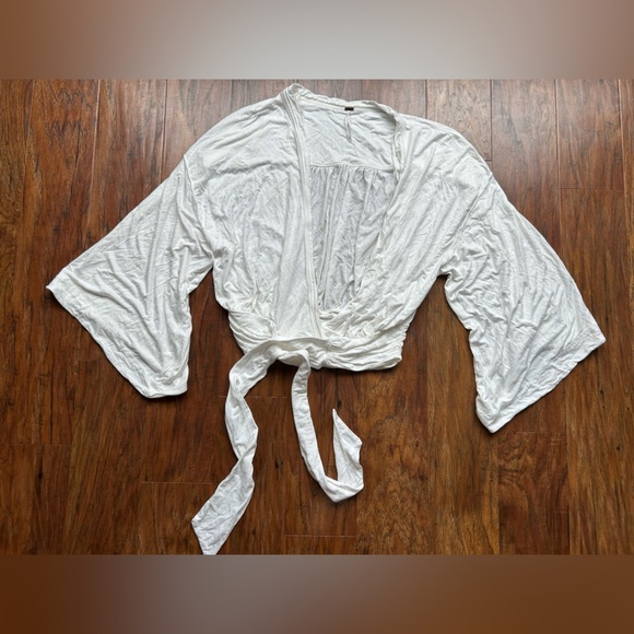 Free People Tops - FREE PEOPLE Wrap Blouse Women’s Size Small Bell Sleeves Boho